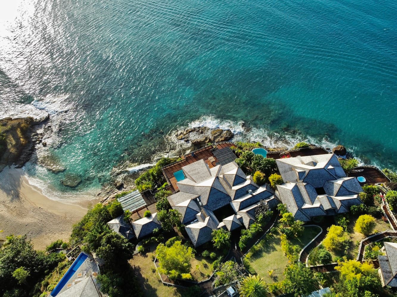 Here a restored Art Deco villa sits above an olive grove with sweeping bay and mountain views.