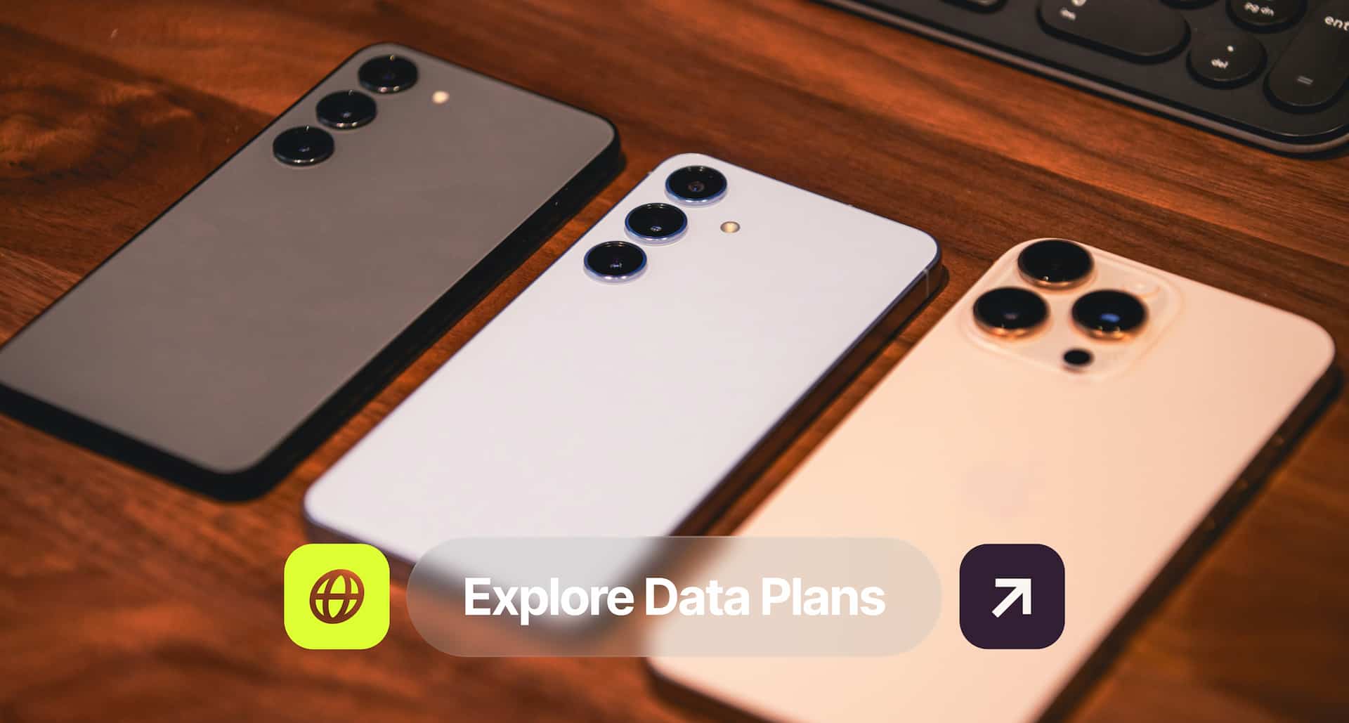 Three smartphones on a wooden surface, each with triple camera setups. A button below reads "Explore Data Plans."