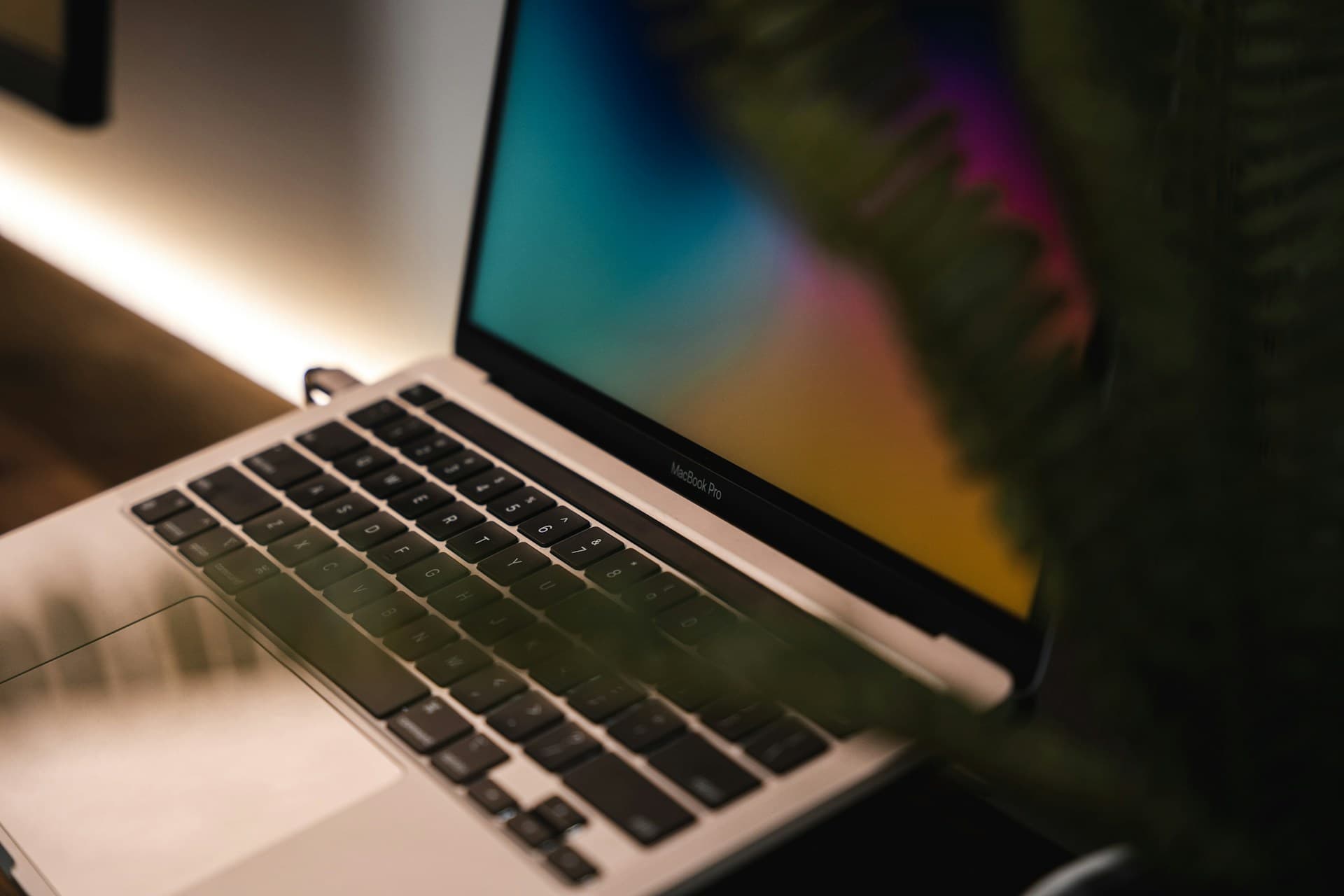 Close-up of a MacBook Pro screen glowing with colour