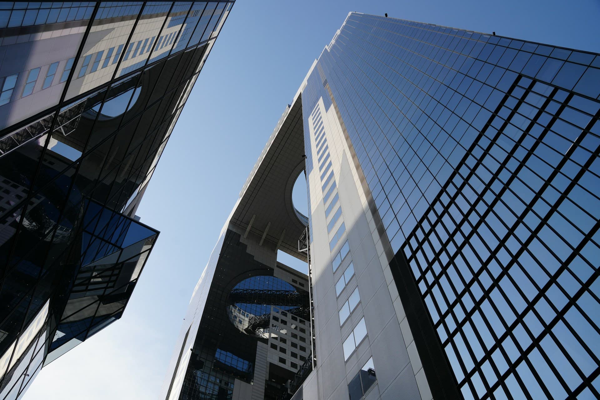 Modern glass office towers viewed from street level
