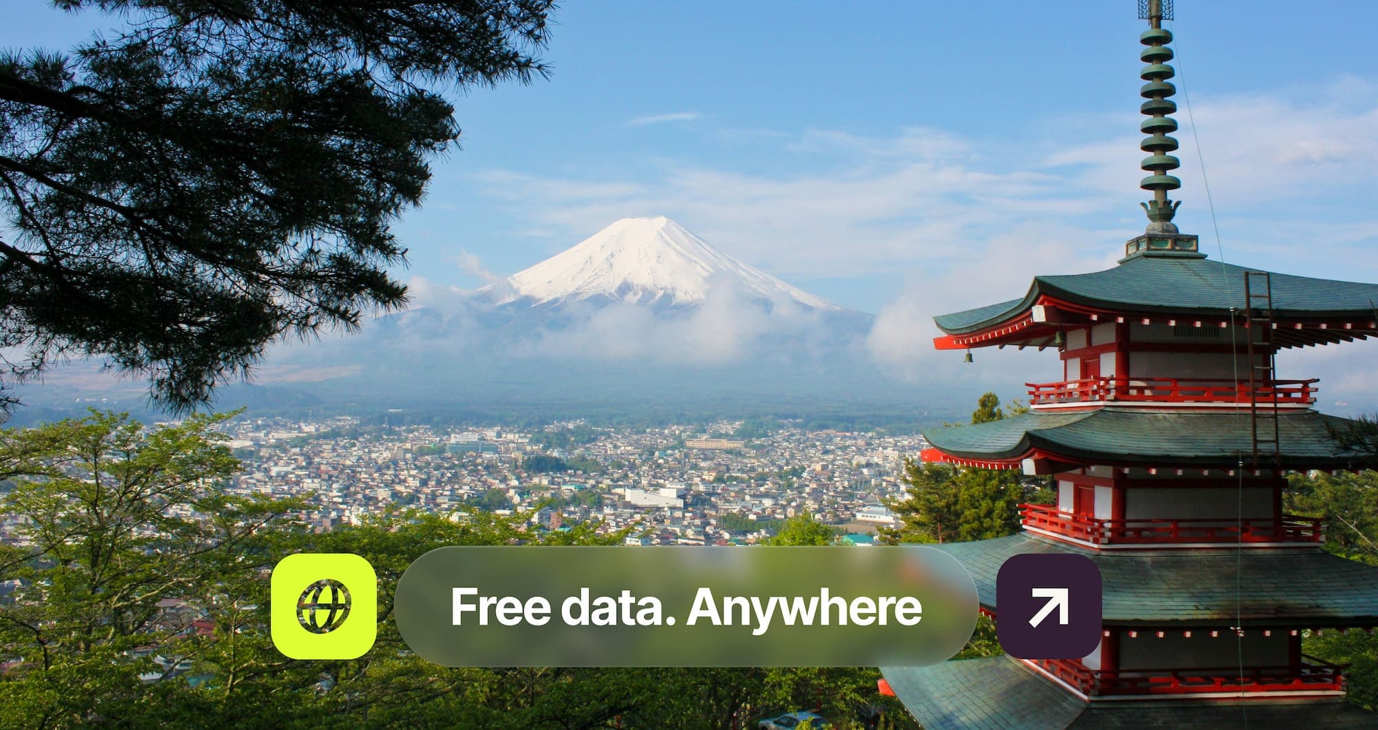 Pagoda overlooking a city with Mount Fuji in the background. Text overlay reads "Free data. Anywhere" with an icon and arrow symbol.
