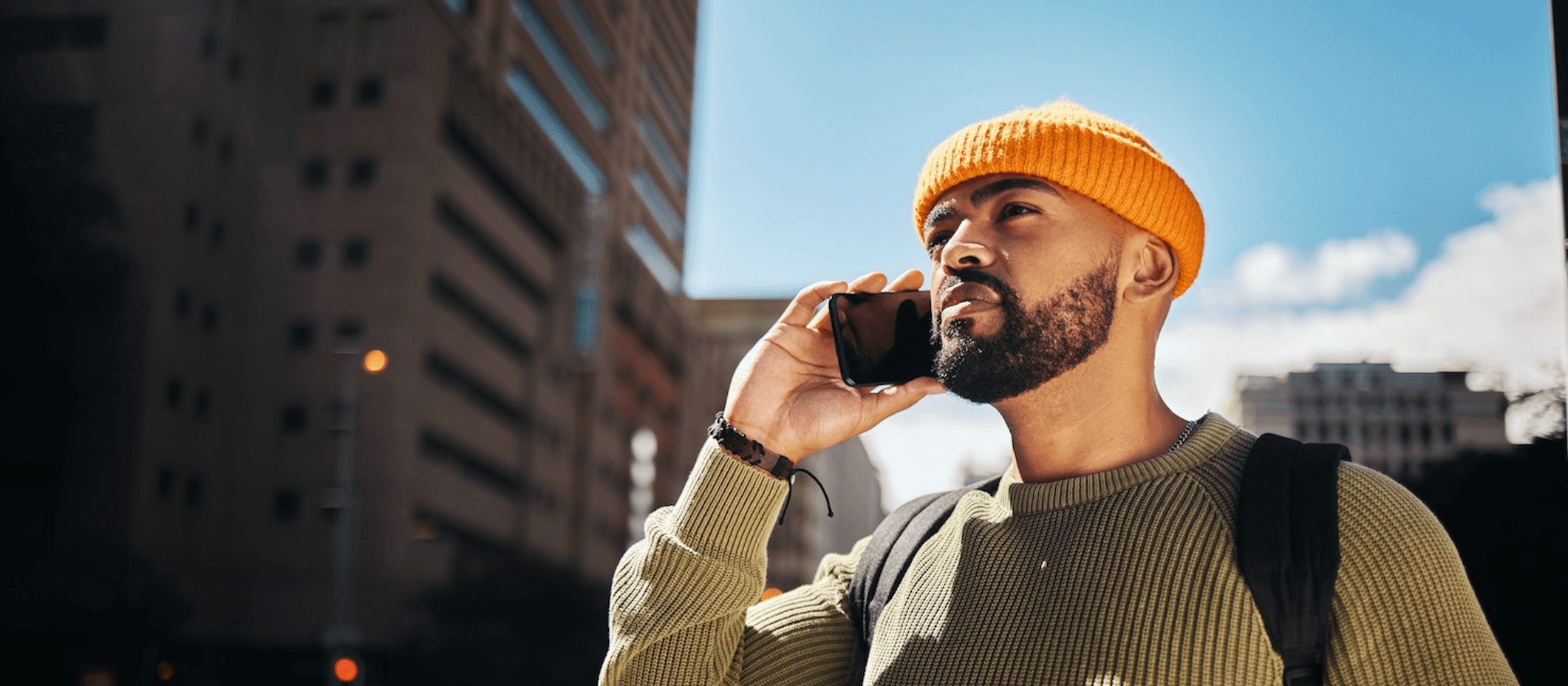 Man making a phone call on a city street in the US