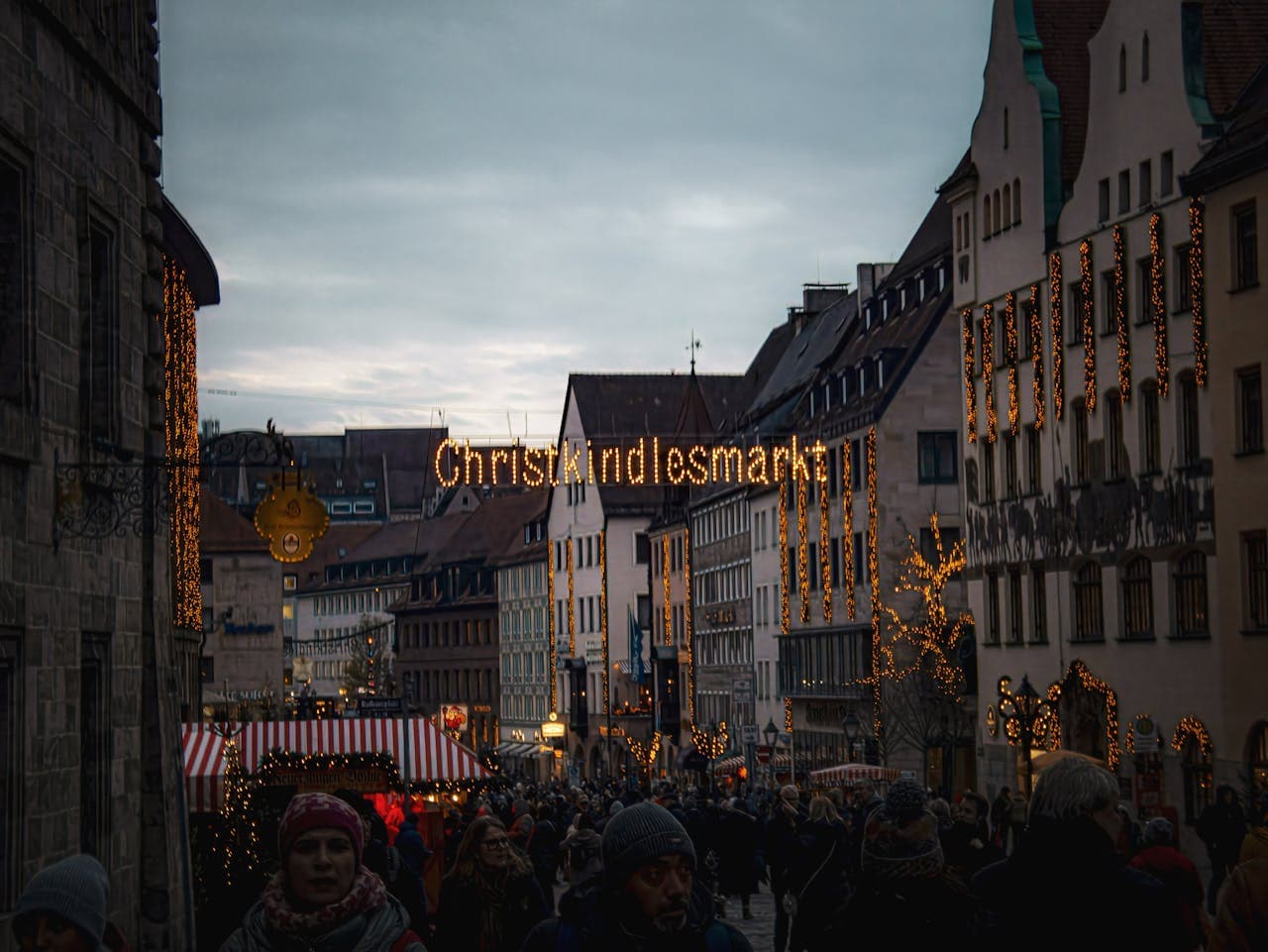Nuremberg's Christkindlesmarkt Christmas market lit up at dusk, Germany